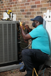 Technician Repairing AC